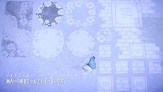 a blue butterfly sitting on top of a white tile covered floor next to a wall