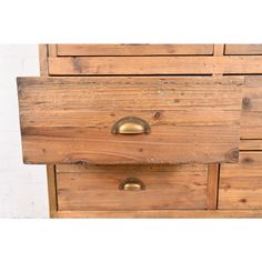 an old wooden dresser with brass handles