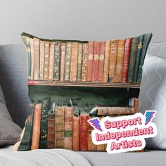 an old book shelf filled with books and the words support independent artists on it throw pillow