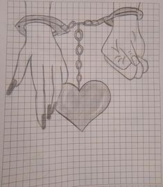 a drawing of two hands and a heart hanging from a chain on a grid paper