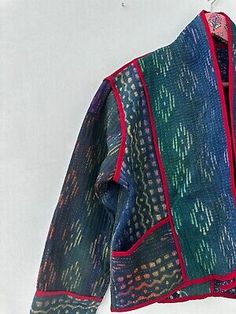 Handmade in India, this jacket features a quilted design with an animal print pattern in a multicolor palette. The outer shell is made of cotton, and the lining is also made of cotton, making it comfortable to wear in any season. Kimono Jacket Pattern, Multicolor Palette, Animal Print Pattern, Animal Prints Pattern, Textile Arts, Short Kimono, Vintage Kantha, Kimono Jacket, Jacket Pattern