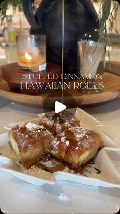 a plate with some food on it and a teapot in the background that says stuffed genamaion hawaiian rolls