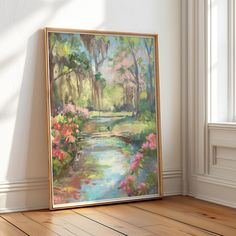 a painting is hanging on the wall in an empty room with wood flooring and white walls