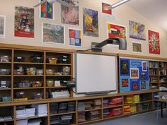 a classroom with lots of books and pictures on the wall