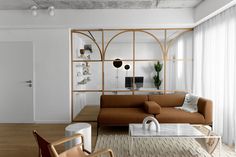 a living room filled with furniture and white walls