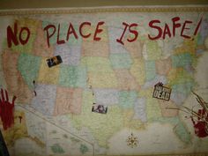 a map that has been decorated with pictures and handwritten words, including the word'no place is safe '