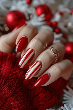 Alternating red and white stripes for a festive and fun holiday look. (Easy DIY technique: Use nail art striping tape for clean lines) Striped Christmas Nails, Christmas Nails Red And White, Red And White Nail Art, Red And White Christmas Nails, Nails Stripes, Pink Christmas Nail, Christmas Nail Design, Acrylic Nail Ideas, The Milky Way Galaxy