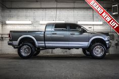 a large gray truck parked in a garage