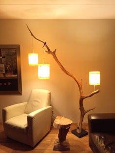 a living room with a white chair and lamp