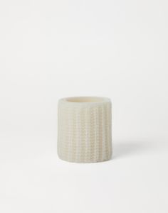 a roll of white tape sitting on top of a table