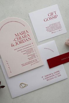 the wedding stationery is laid out on top of each other