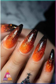 Halloween Sparkly Nails, Black And Orange Ombre Nails Halloween, Purple And Orange Ombre Nails, Simple October Nail Designs, Black Nails With Orange Glitter, Glow Halloween Nails, Orange And Black Halloween Nail Designs, Witchy Fall Nails, Orange And Black Ombre Nails