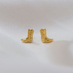 Gold Cowgirl Boot Earrings  - these are the cutest little studs!  Also perfect for Space Cowgirl - Disco Cowgirl bachelorette party gifts!   ♥ Measurements: tiny & sweet!   ♥ Materials: dipped in 12 K gold plating. Posts are titanium - good for sensitive ears! ♥ Packaged in our gift box ♥  Designed by & exclusive to Wildflower + Co. ♥ Imported ♥ Product safety - intended for use by adults only; CA residents - see shop policies for Prop 65 warning ♥ Includes 1 pair of earrings Gold Country Jewelry, Cowgirl Accessories Earrings, Western Gold Earrings, Cowgirl Boot Clay Earrings, Disco Cowgirl Bachelorette Party, Disco Cowgirl Bachelorette, Cowboy Boot Earrings, Cowgirl Disco, Cowgirl Bachelorette Party