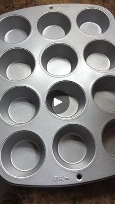 an empty muffin pan sitting on top of a counter