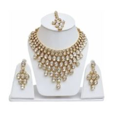 Product Details Base Material Alloy Color- Gold, White Type-Necklace, Earring & Maang Tikka Set Ideal For-Girls, Women Plating-Gold-Plated Net Quantity-1 1 Necklace, 2 Earring, 1 Maang Tikka Collection- Contemporary Occasion- Wedding & Engagement Traditional Kundan Dulhan Bridal Jewellery Set This Traditional Bridal Jewelry Combo Necklace Set Is The Best Set Of Accessory To Enhance Your Beauty And Compliment You On Your Wedding Day. Made Of Brass Alloy And Kundan Settings, The Classic Ensemble W Dulhan Bridal, Jewelry Combo, Traditional Bridal Jewelry, Maang Tikka Set, Bridal Jewellery Set, Maang Tikka, Enhance Your Beauty, Ethnic Design, Jewellery Set