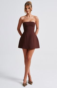 Simple and seriously chic, the Asha mini is this season's obsession. Perfect to wear for date nights, late nights and beyond, this strapless design is finished with seam details and a bubble shape skirt for extra volume. 



Colour: Brown.

Premium non-stretch crepe.

Fully lined.

Strapless.

Hugs the figure.

Seam details.

Bubble shape skirt.

Invisible zip fastening.

Mini length.

Model is an XS and is wearing an XS.

 Size: XS, S, M, L, XL, XXL Strapless Mini Dress With Fitted Bodice For Date Night, Lined Strapless Mini Dress For Night Out, Chic Short Party Dress, Strapless Fitted Bodice Mini Dress Lined, Chic Strapless Mini Dress For Date Night, Strapless Mini Dress With Fitted Bodice And Lining, Date Night Strapless Mini Dress With Fitted Bodice, Chic Short Evening Dresses, Chic Short Mini Dress For Date Night