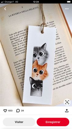 a bookmark with two cats on it and the caption reads, energetater