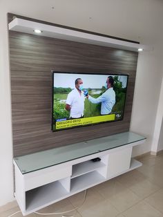 a flat screen tv mounted to the side of a wall