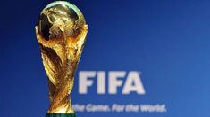 the world cup trophy is displayed in front of a blue background