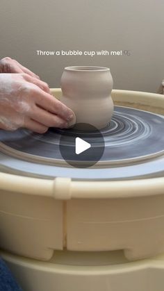 a person is making a pot on a potter's wheel with the words, throw a bubble cup with me