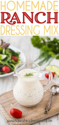 homemade ranch dressing mix in a pitcher on a cutting board with tomatoes and lettuce