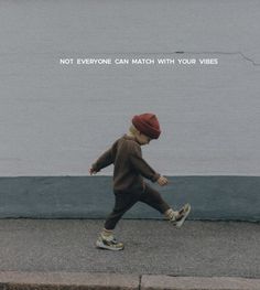 a young child is running on the sidewalk with a quote above it that says not everyone can match with your vibes