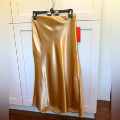 Rich Gold Satin Like Material Looks Great With A Black Cashmere Sweater Or A Graphic Tee And Denim. Many Possibilities Gold Silk Skirt, Long Gold Silk Skirt, Gold Satin Party Skirt, Bronze Satin Skirt, Satin Gold Midi Skirt, Gold Satin Skirt, Black Cashmere Sweater, Hot Kiss, Gold Satin