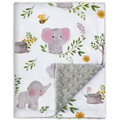 a baby blanket with an elephant on it and yellow flowers around the edges, in front of a white background