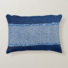 a denim pillow with blue and white stripes