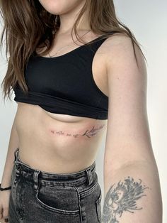 a woman with a tattoo on her arm