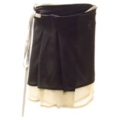 A delicate silk wrap mini skirt is black with a light grey layer beneath. It features a back pocket with flap and red stitching at back label. Black Mini Wrap Skirt With Lining, Yohji Yamamoto Street Style, Street Style Skirt, Black Wrap Skirt, Silk Wrap Skirt, Mini Wrap Skirt, Wrap Mini Skirt, Fashion Sites, Silk Wrap