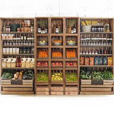 an assortment of fruits and vegetables in wooden crates