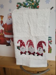 a towel with santa claus on it hanging from a rack