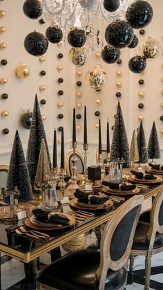 a dining room table with black and gold decorations