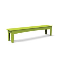 a green bench sitting on top of a white floor