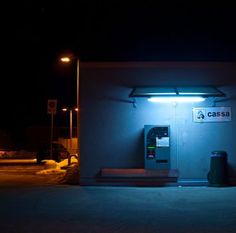 a phone booth lit up in the dark