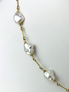 White keshi pearl station necklace on fun chain. Necklace contains 11pcs 6.5x9-9x11mm white keshi pearls in stations on a 15.5" long 14k yellow gold textured bar chain. Metal - 14K Yellow Gold Pearls - Keshi Length - 15.5" Pearl Bridal Jewelry, Pearl Jewellery, Keshi Pearls, Station Necklace, Bridal Pearls, Short Necklace, Gold Texture, Gold Pearl, Earring Necklace