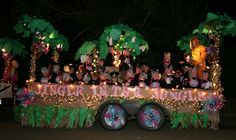 a parade float decorated with lights and decorations