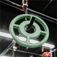 a green circular object hanging from the ceiling