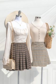 Inspired by vintage academia, the Daphné mini skirt features a pleated hem, brown plaid print, and a short length. Perfect with tights, a cardigan, and beret for a french-inspired collegette look! Please Note- This item is final sale only. . Details: S: Waist 28", Length 16" M: Waist 30", Length 16.5" L: Waist 32", Length 17" Unlined Material: 97% Polyester, 3% Spandex Hand Wash Cold / Hang Dry Imported Ships in 1 to 2 Business Days Free US Shipping on Orders over $100 Mini Plaid Skirt Outfit, Brown Pleated Skirt Outfit, Pastel Academia Outfit, Brown Plaid Skirt Outfit, Librarian Core, Pastel Academia, Pleated Short Skirt, Brown Pleated Skirt, Vintage Academia