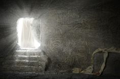 the light shines through an open window into a dark room with stone steps leading up to it