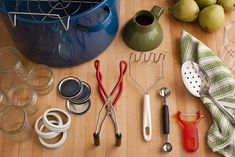 various kitchen utensils are laid out on a table