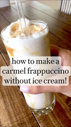 someone holding up a glass with ice cream in it and the words how to make a caramel frappuccino without ice cream