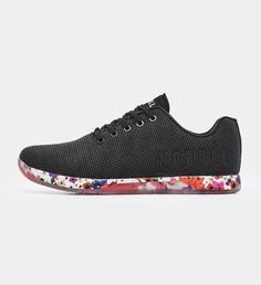 a women's shoe with floral print on the bottom and black upper part,