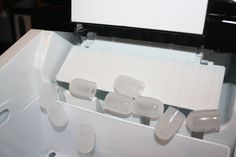 there are several pieces of white plastic in the box that is open and ready to be used