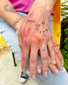 a person's hand with writing on it