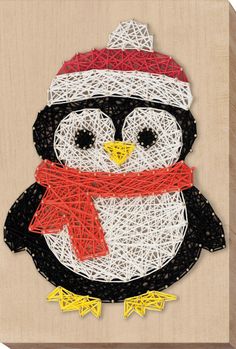 a penguin with a red scarf and hat on it's head is made out of string