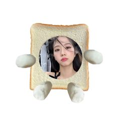 an image of a woman with her face in a slice of bread