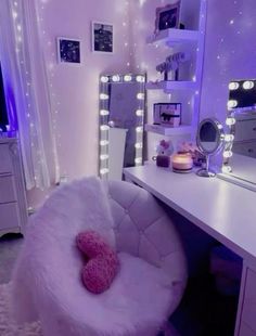 a white chair sitting in front of a mirror on top of a desk next to a dresser