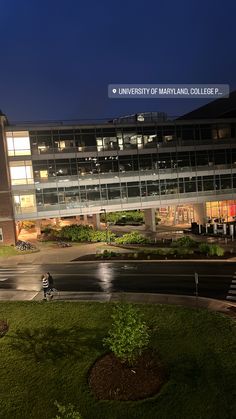 the university of maryland college campus at night with people walking and riding their bikes